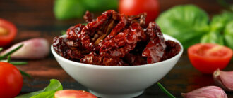 stock-photo-sun-dried-tomatoes-in-white-bowl-with-fresh-herbs-and-spices-on-wooden-table?token=w1725354821lHsL5ZrE4jD7zEh6kCqByqg41kdvV